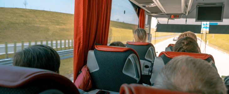 A picture of the back of a passengers in a minibus